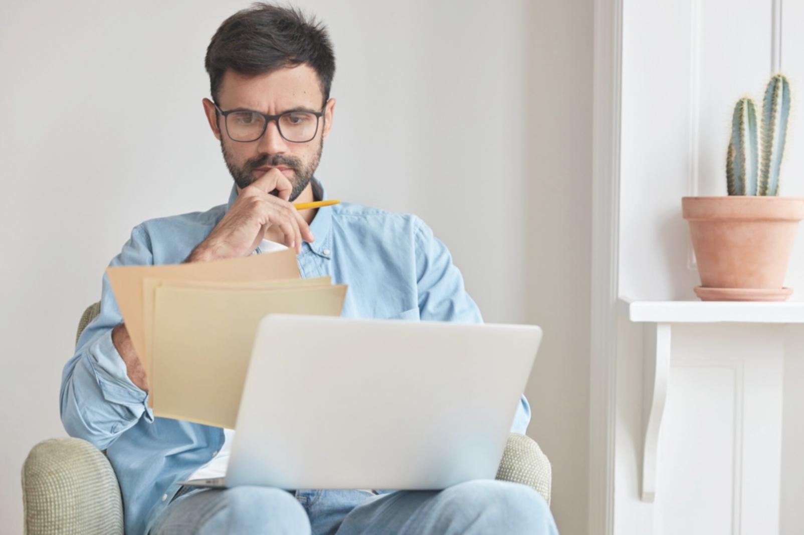 Financial analysis workspace with charts and research materials